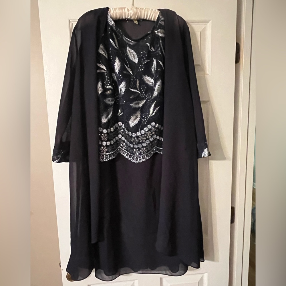 Knee length navy cocktail dress.